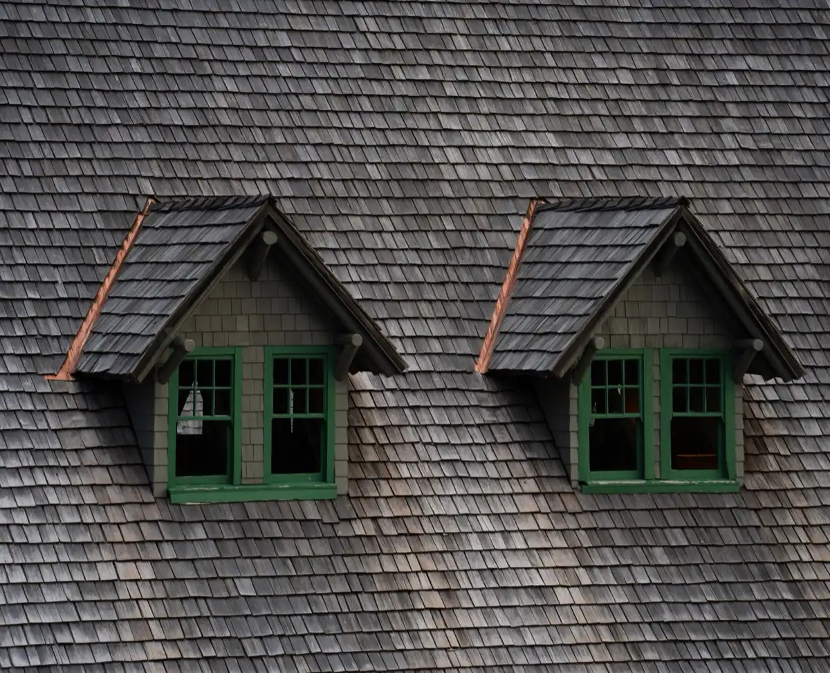 Dormers on a shingle roof in Sterling Heights, MI, where step flashing and kickout flashing carry water past the walls